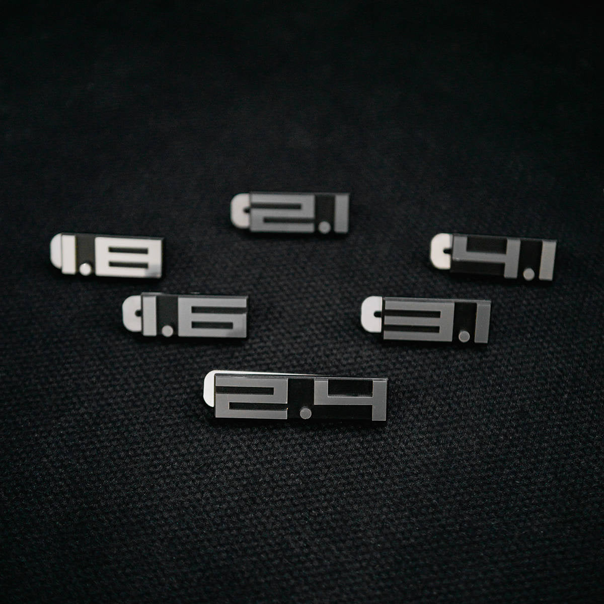 Rear deck lid grille displacement badge/emblem
