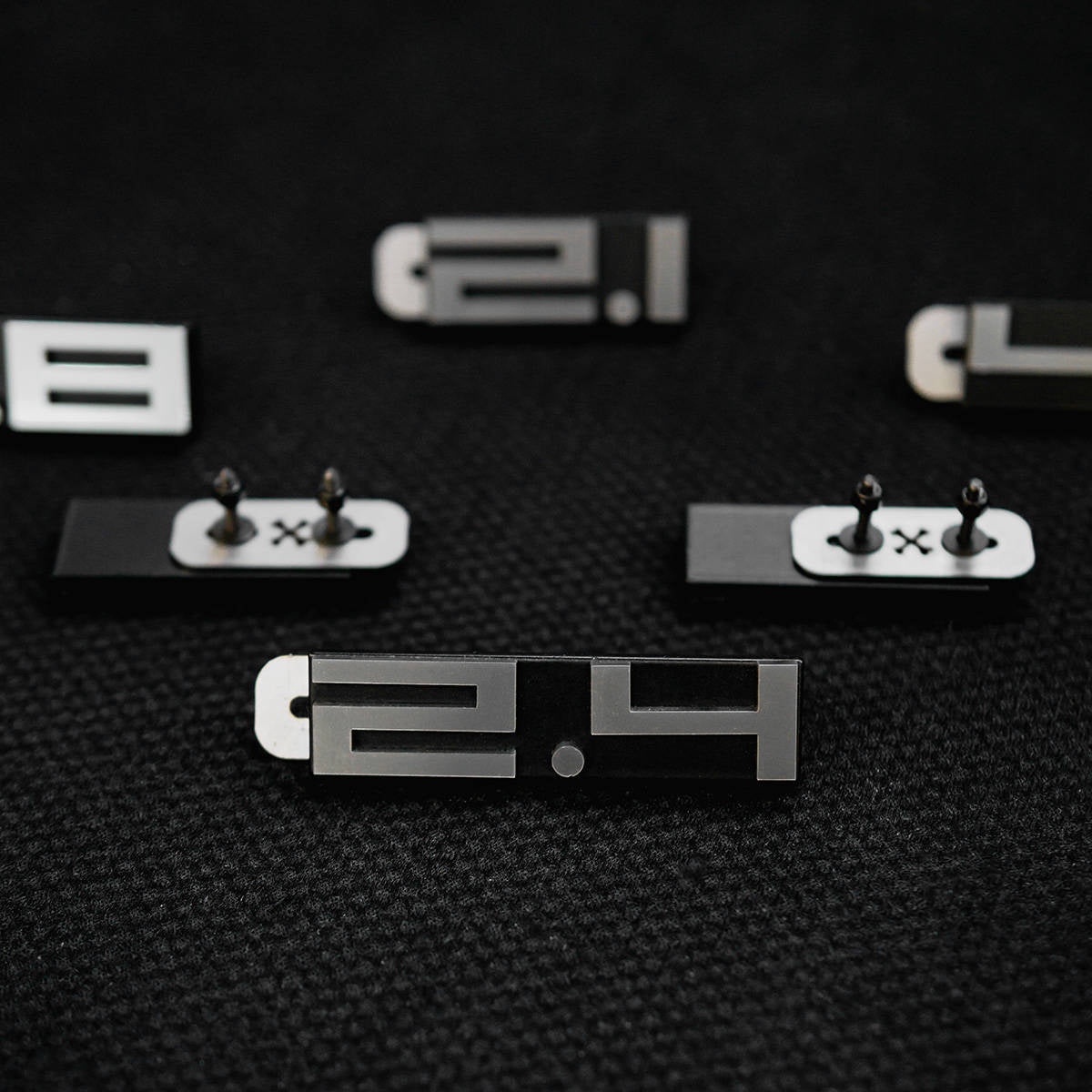 Rear deck lid grille displacement badge/emblem